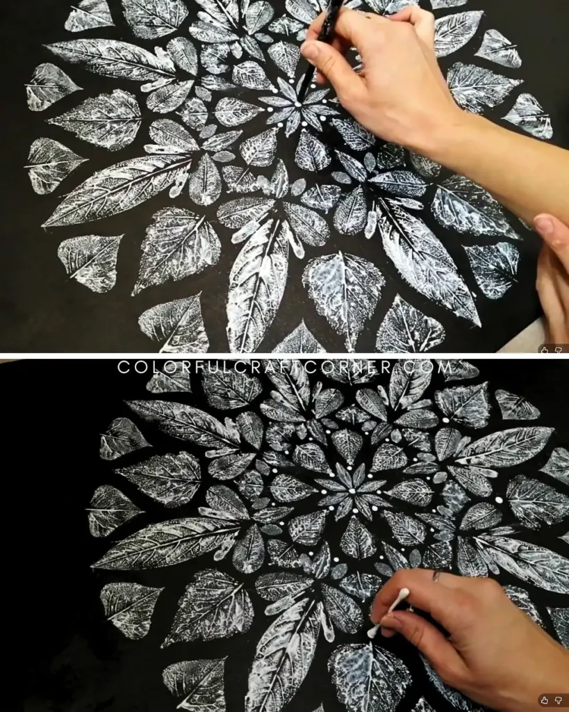 Adding details to the leaf mandala canvas art with q-tips and acrylic paint