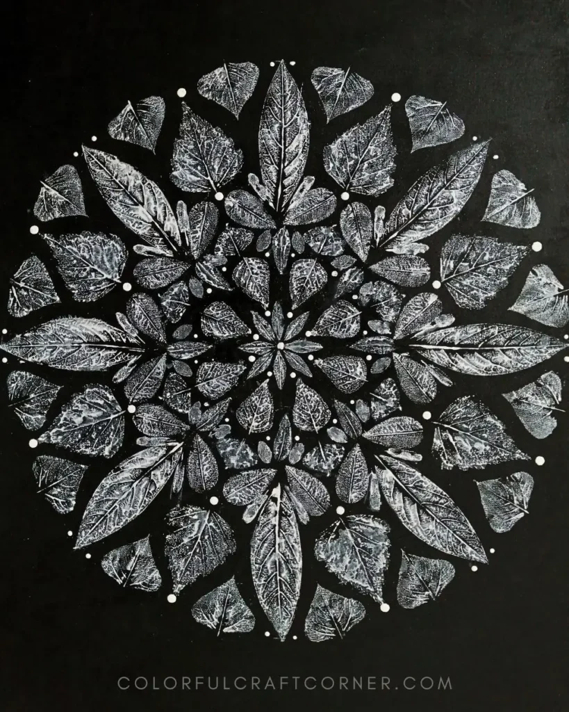 Leaf print mandala canvas wall art made with white acrylic paint on black background using real leaves
