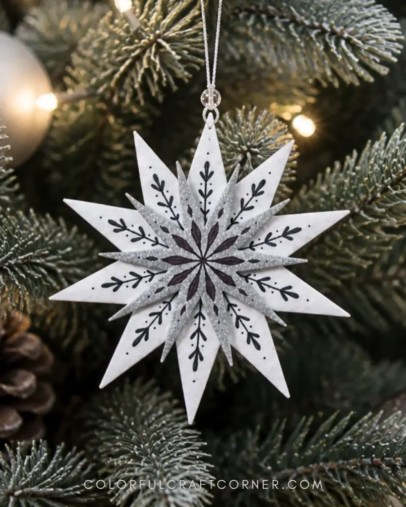 DIY shrink plastic Christmas star ornaments hanging on tree